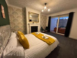 a bedroom with a bed with two towels on it at Kenton Lane in Kenton