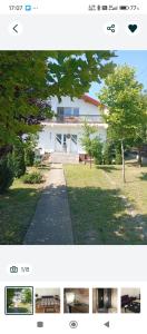 ein Bild von einem Haus mit einem Baum davor in der Unterkunft Casa Rediu Iasi in Iaşi