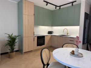 Η κουζίνα ή μικρή κουζίνα στο Apartament Wileńska