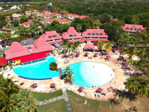 an aerial view of a resort with a pool at Sur la Plage P&V Village Vacances Sainte-Anne in Sainte-Anne