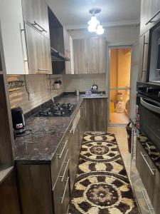 Η κουζίνα ή μικρή κουζίνα στο Cozy Comfort Flat , Madinaty +23 φωτογραφίες