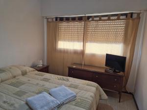 Postel nebo postele na pokoji v ubytování Atlántico Peatonal 2