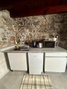 Kuchyň nebo kuchyňský kout v ubytování Palheiro Mar by Olá Madeira