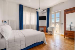 Ένα ή περισσότερα κρεβάτια σε δωμάτιο στο Villa Rosaria