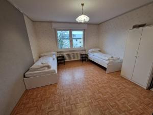 Postel nebo postele na pokoji v ubytování RHE 6P Balkon Küche