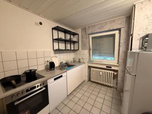 Kuchyň nebo kuchyňský kout v ubytování RHE 6P Balkon Küche