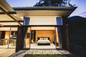 a bedroom in a house with a bed in it at Willow at Barranca - Luxury Villa in Barrengarry