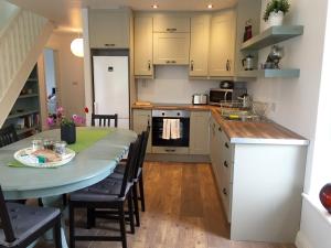 a kitchen with a table and chairs in a room at Casa Ceol in Ennis