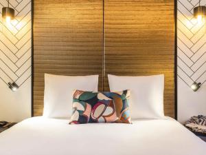 Ένα ή περισσότερα κρεβάτια σε δωμάτιο στο Mercure Luxembourg Off Kirchberg +56 φωτογραφίες