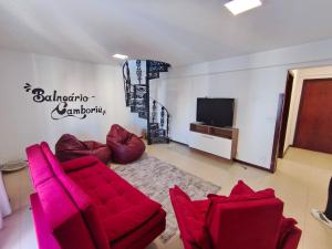 Μια τηλεόραση ή/και κέντρο ψυχαγωγίας στο Cobertura duplex c/ terraço e churrasqueira em BC