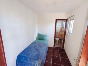 Ένα ή περισσότερα κρεβάτια σε δωμάτιο στο Cobertura duplex c/ terraço e churrasqueira em BC