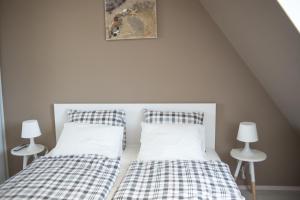 two beds sitting next to each other in a bedroom at Flat with Unforgettable View in Budapest