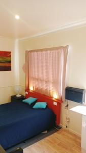 Postel nebo postele na pokoji v ubytování Eleven88