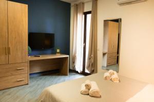 TV a/nebo společenská místnost v ubytování Appartamento completo parcheggio privato - Villa Ciaculli