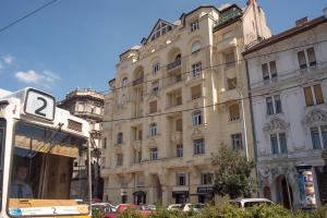 a building with a bus parked in front of it at Flat with Unforgettable View in Budapest