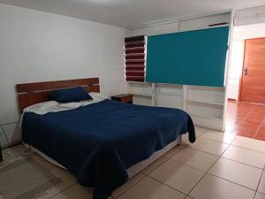 Ένα ή περισσότερα κρεβάτια σε δωμάτιο στο Piedras Blancas