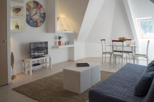 a living room with a couch and a table at Flat with Unforgettable View in Budapest