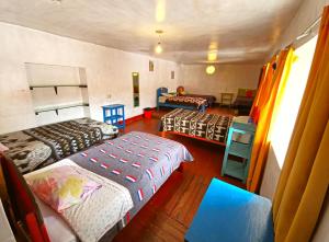 Postel nebo postele na pokoji v ubytování Hostel Rivendell Cusco
