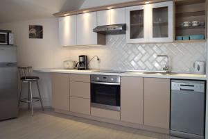 a kitchen with a sink and a stove at Flat with Unforgettable View in Budapest