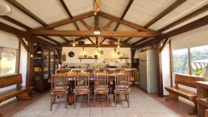 a large dining room with a table and chairs at Villa Anna Salento in Presicce