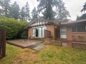 a house with a patio and a table in the yard at The Sunshine Haven in Delta