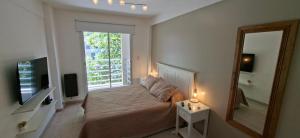 Μια τηλεόραση ή/και κέντρο ψυχαγωγίας στο Apartamento exclusivo con ubicación preferencial