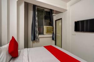 Ένα ή περισσότερα κρεβάτια σε δωμάτιο στο Hotel O PubG Residency