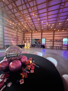a room with a table and balloons on the floor at Hidden Gem Farm Homestead Sleeps 12 &Fresh Produce in Spring Hill