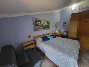 Ένα ή περισσότερα κρεβάτια σε δωμάτιο στο Borgo Maggiore