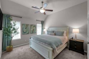 a bedroom with a bed and a ceiling fan at Aspen Drive in Montgomery