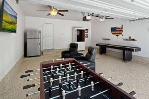 a living room with a chess board and a table at Aspen Drive in Montgomery
