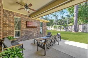 a patio with benches and a ceiling fan at Aspen Drive in Montgomery