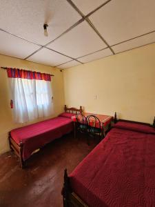 Ένα ή περισσότερα κρεβάτια σε δωμάτιο στο Pelito