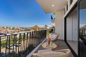 a balcony with a table and chairs and a view at Double Suite Luxury Retreat 605 Tower in Cabo San Lucas +4 photos