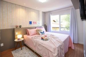 Ένα ή περισσότερα κρεβάτια σε δωμάτιο στο Rosa Edifício Prime Elegance