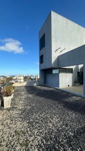 a building on top of a large pile of gravel at Bright on the avenue in Mar del Plata