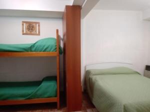 Postel nebo postele na pokoji v ubytování Marieta