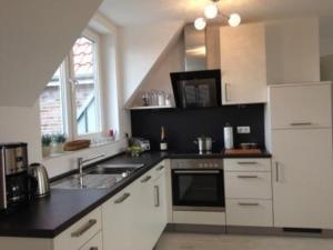 Kuchyň nebo kuchyňský kout v ubytování Haus zur Post, App 17