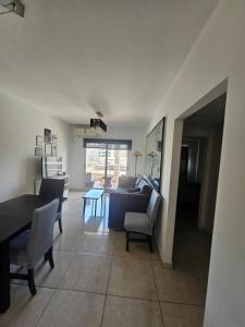 a living room with a couch and a table at PALERMO APART 1 in Buenos Aires