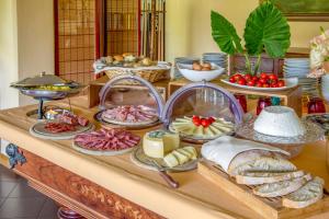 a table topped with lots of different types of food at Valle Del Buttero in Capalbio