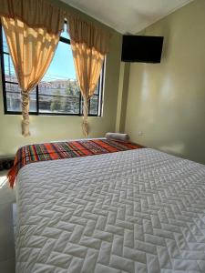 Postel nebo postele na pokoji v ubytování Hostal Marín Central - Quito