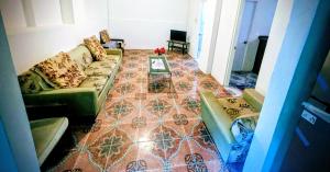 a living room with a couch and a table at BtC Apartments St Paul's in Saint Paulʼs