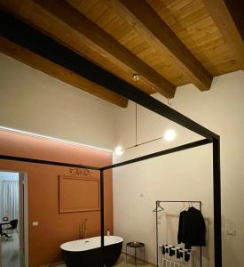 a bathroom with a bath tub in a room at La Trita Dimore di Charme in Bussi sul Tirino +19 photos
