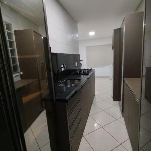 Η κουζίνα ή μικρή κουζίνα στο AP Morada das Palmeiras