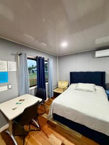 Ένα ή περισσότερα κρεβάτια σε δωμάτιο στο Sunshine Cabanas At Ocean View