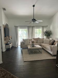 a living room with a couch and a table at Beautiful 2 Bedroom 2 Bathroom Condo in Naples