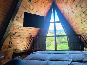 Postel nebo postele na pokoji v ubytování chalé okinawa