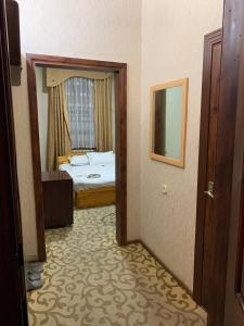 Voodi või voodid majutusasutuse Royal Garden toas