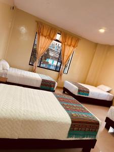Postel nebo postele na pokoji v ubytování Hostal Marín Central - Quito
