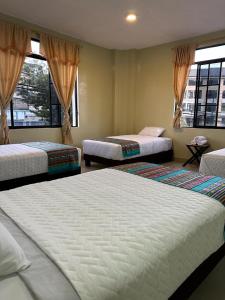 Postel nebo postele na pokoji v ubytování Hostal Marín Central - Quito
